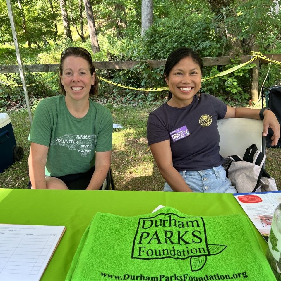 DPR Staff Liaison Emilie McIntosh and DPF Board Member Farrah Sangsookwow Shapiro share information about the Durham Parks Foundation at Festival on the Eno in 2022.